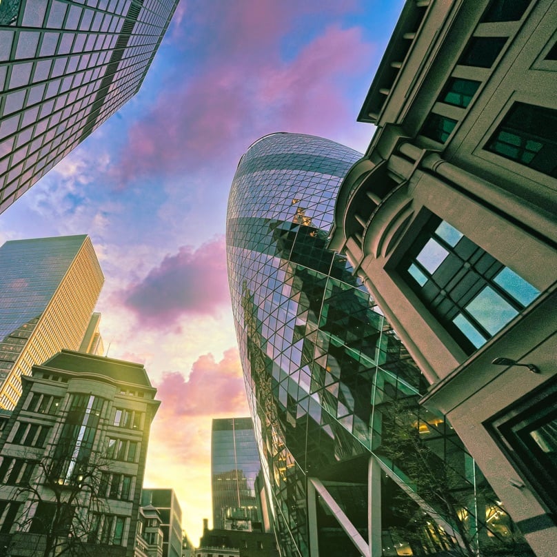 City of London office buildings at dawn.