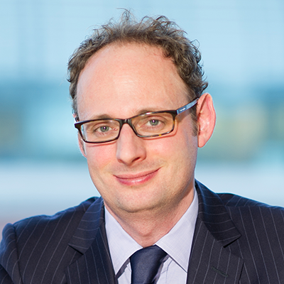 Headshot of Piers Aldred smiling at the camera.