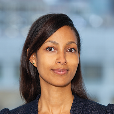 Headshot of Sennait Adhanom looking at the camera.