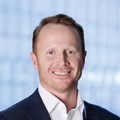 Headshot of Jonathan Baird smiling at the camera.