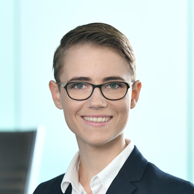 Headshot of Alex Brandford smiling at the camera.