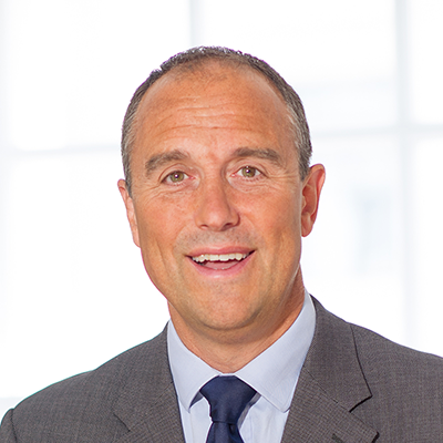 Headshot of Chris Bates smiling at the camera.