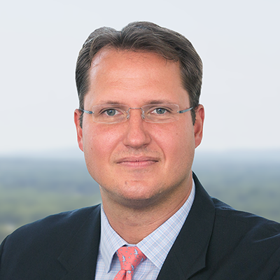 Headshot of Greg Behling smiling at the camera.