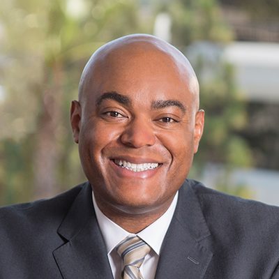 Headshot of Chris Berry smiling at the camera.
