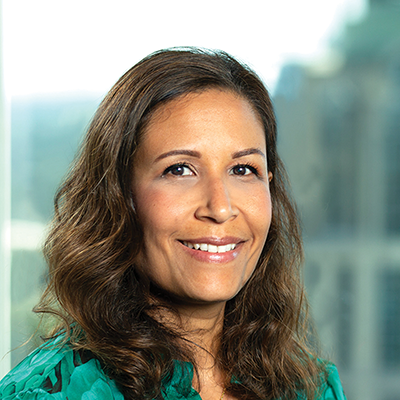 Headshot of Itzbell Branca smiling at the camera.