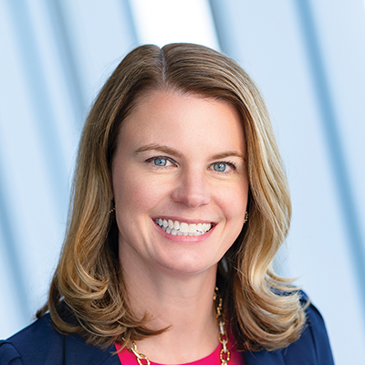 Headshot of Kelly Burton smiling at the camera.