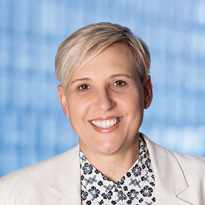 Headshot of Tammy Callaghan smiling at the camera.
