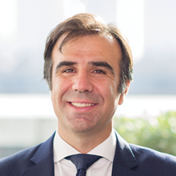 Headshot of Jose Garcia Cedrun smiling at the camera.