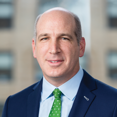 Headshot of Andrew Coats smiling at the camera.