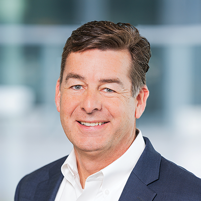 Headshot of David Coutu smiling at the camera.
