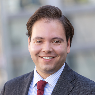 Headshot of Christian Cretu smiling at the camera.