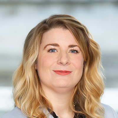 Headshot of Jess Cufley smiling at the camera.