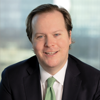 Headshot of JM Chadonic smiling at the camera.