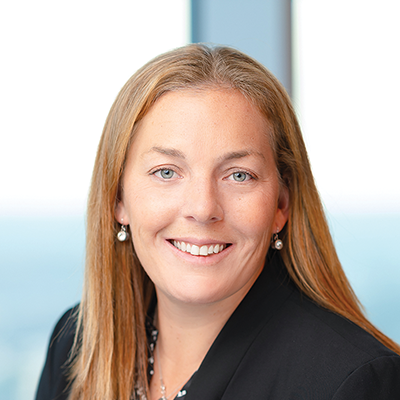 Headshot of Ginny Chiarello smiling at the camera.