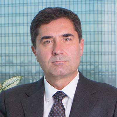 Headshot of Tom Duski smiling at the camera.