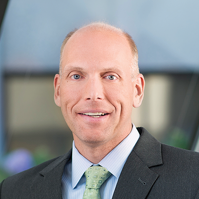 Headshot of Stephen Ehrenberg smiling at the camera.