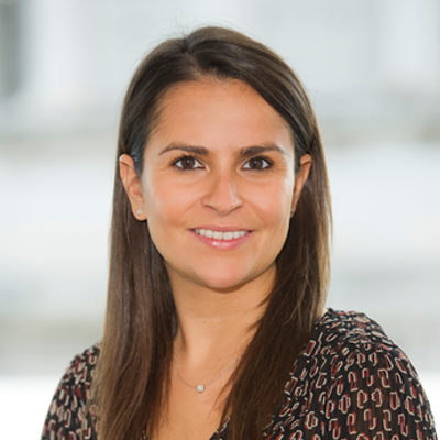 Headshot of Sarah Einig smiling at the camera.