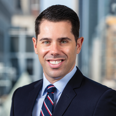 Headshot of Greg Eudicone smiling at the camera.