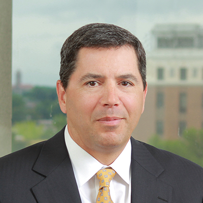 Headshot of Joe Evanchick smiling at the camera.