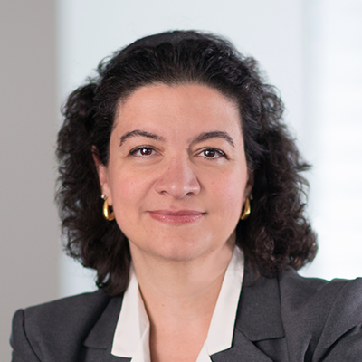 Headshot of Vasiliki Everett smiling at the camera.