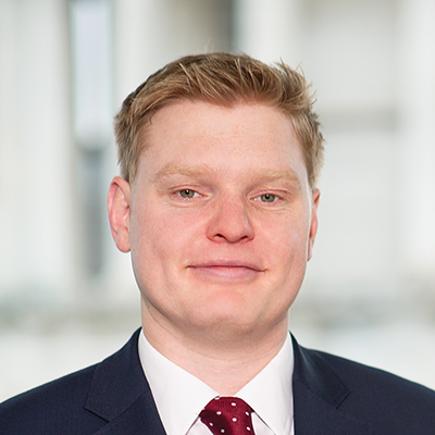 Headshot of Callum Fraser smiling at the camera.
