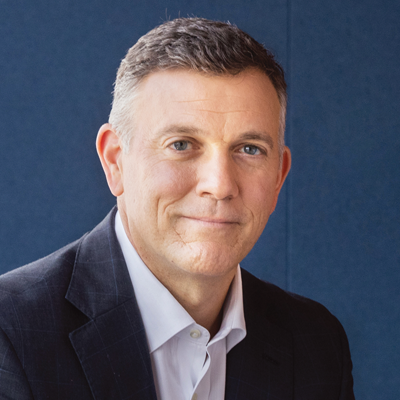 Headshot of Mike Freno smiling at the camera.