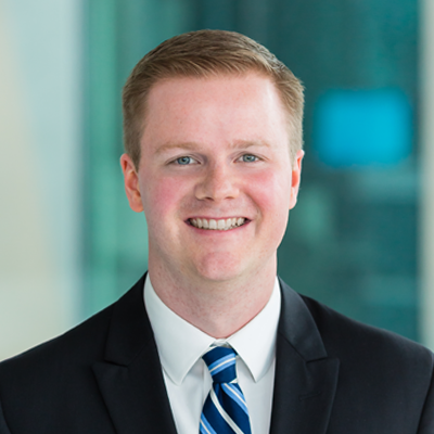 Headshot of Dan Gordon smiling at the camera.