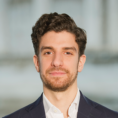 Headshot of Giacomo Greggio smiling at the camera.