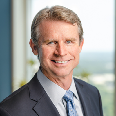 Headshot of Ken Griffin smiling at the camera.