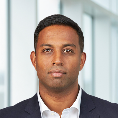 Headshot of Somit Guha smiling at the camera.