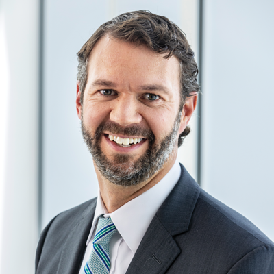 Headshot of Patrick Hoefling smiling at the camera.
