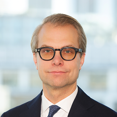 Headshot of Jonas Karlson smiling at the camera.