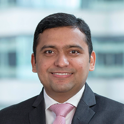 Headshot of Kuldeep Khanapurkar smiling at the camera.