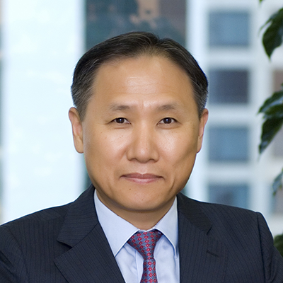 Headshot of Beom Kim smiling at the camera.