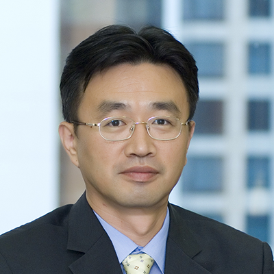 Headshot of Kyle Kim smiling at the camera.