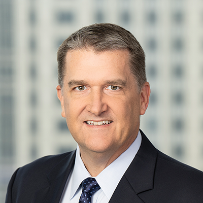 Headshot of Douglas Koch smiling at the camera.