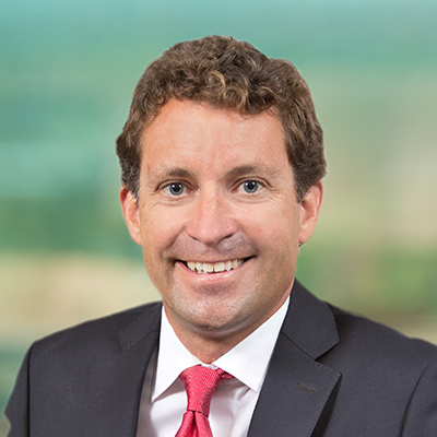 Headshot of John Kolb smiling at the camera.