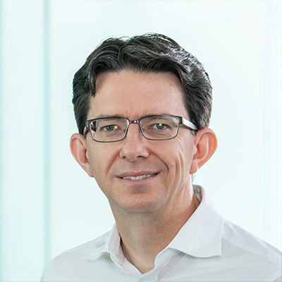Headshot of Christian Larney smiling at the camera.