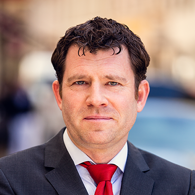 Headshot of Simon Lauinger smiling at the camera.
