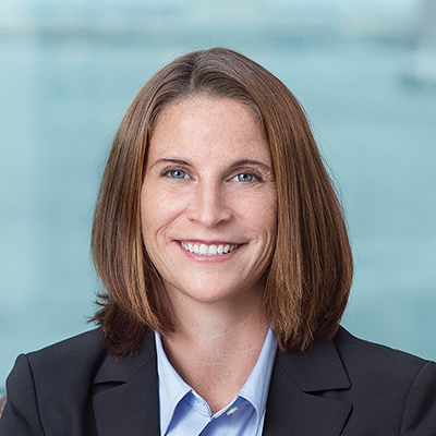 Headshot of Taryn Leonard smiling at the camera.