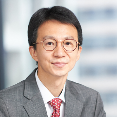 Headshot of Tiebin Liu smiling at the camera.