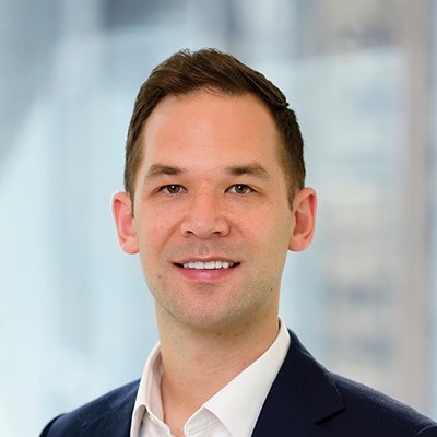 Headshot of David Lousick smiling at the camera.