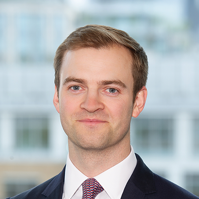 Headshot of Thomas Lowton smiling at the camera.
