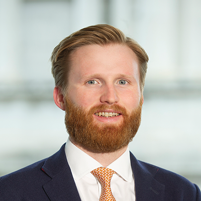 Headshot of Henry Marlow smiling at the camera.