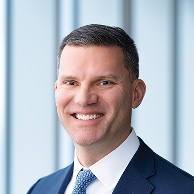 Headshot of Nicholas Mavro smiling at the camera.