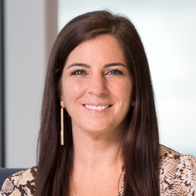 Headshot of Sarah Munday smiling at the camera.