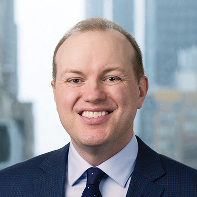 Headshot of Kevin Mihelic smiling at the camera.