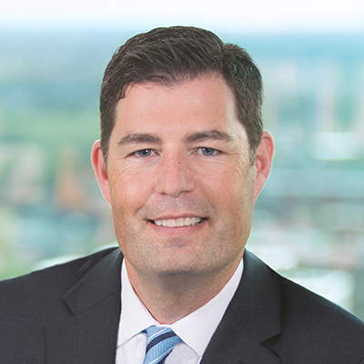 Headshot of Kevin Miller smiling at the camera.