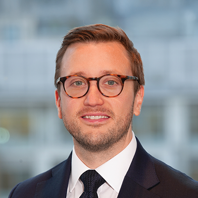Headshot of Phillip Nicholass smiling at the camera.
