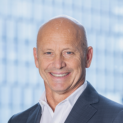 Headshot of Paul Notaras smiling at the camera.